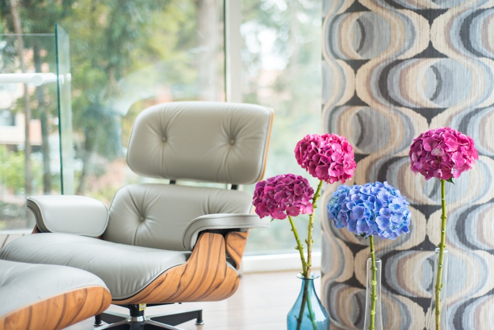 pink-and-blue flowers beside armchair