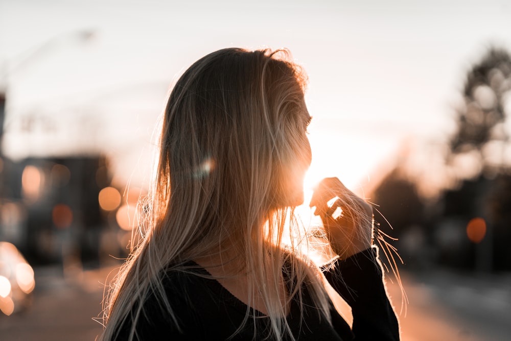 woman about to touch her mouth