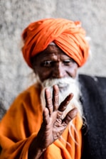 man wearing orange turban