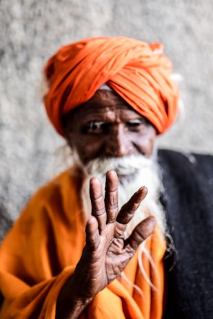 man wearing orange turban