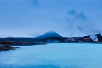 mountain in-front body of water