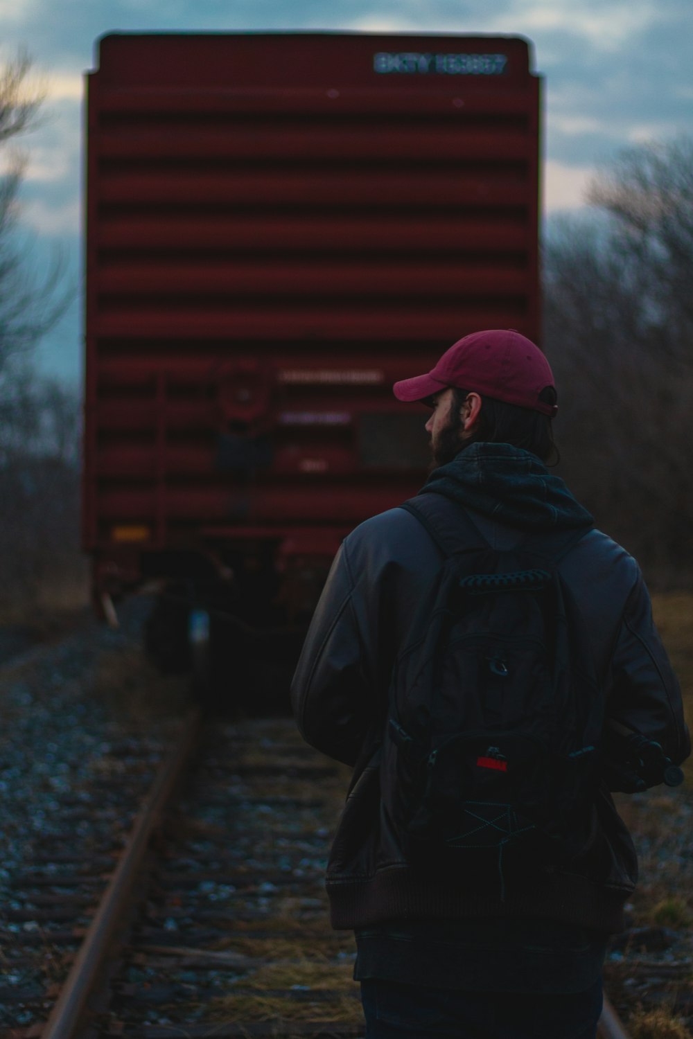 person walking on train rail