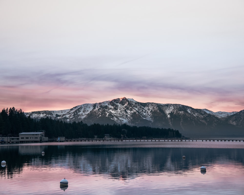 mountain in-front body of water