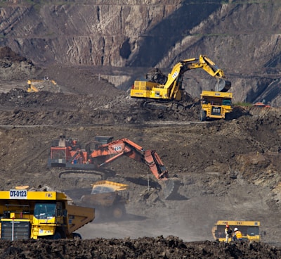 photography of excavators at mining area