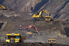 photography of excavators at mining area