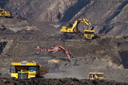 photography of excavators at mining area