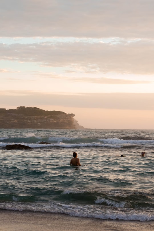woman on body of water in Bronte Beach Australia