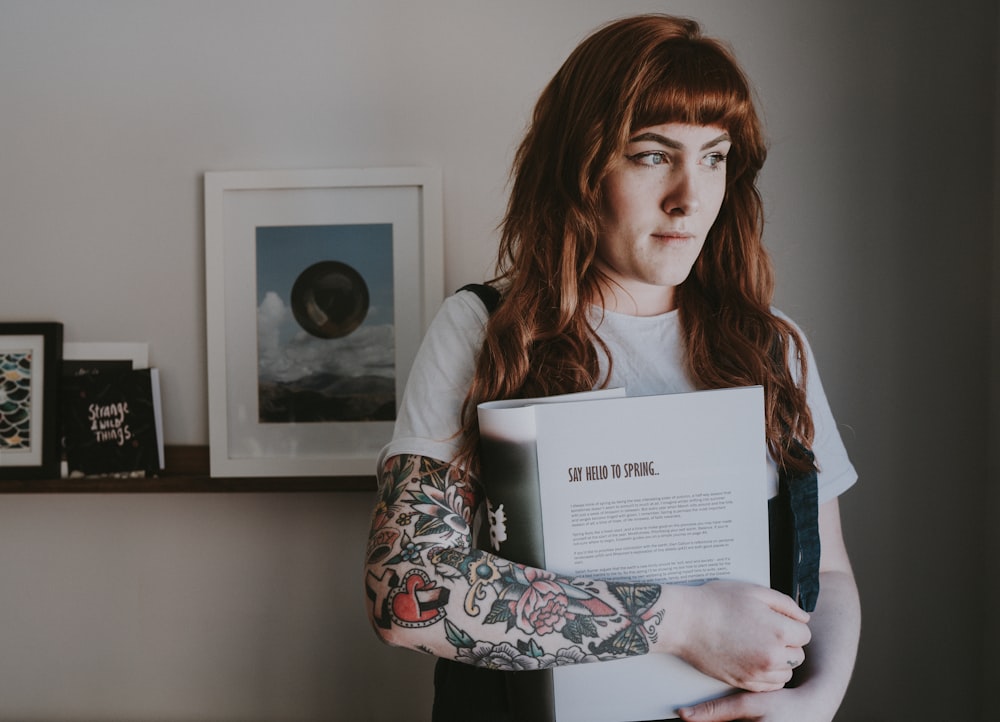 woman carrying book