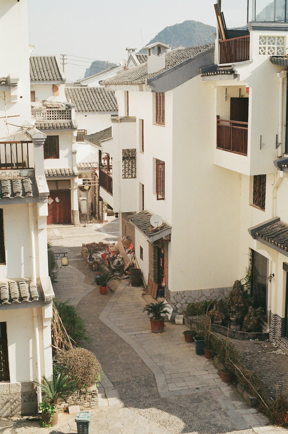 white concrete houses near mountain