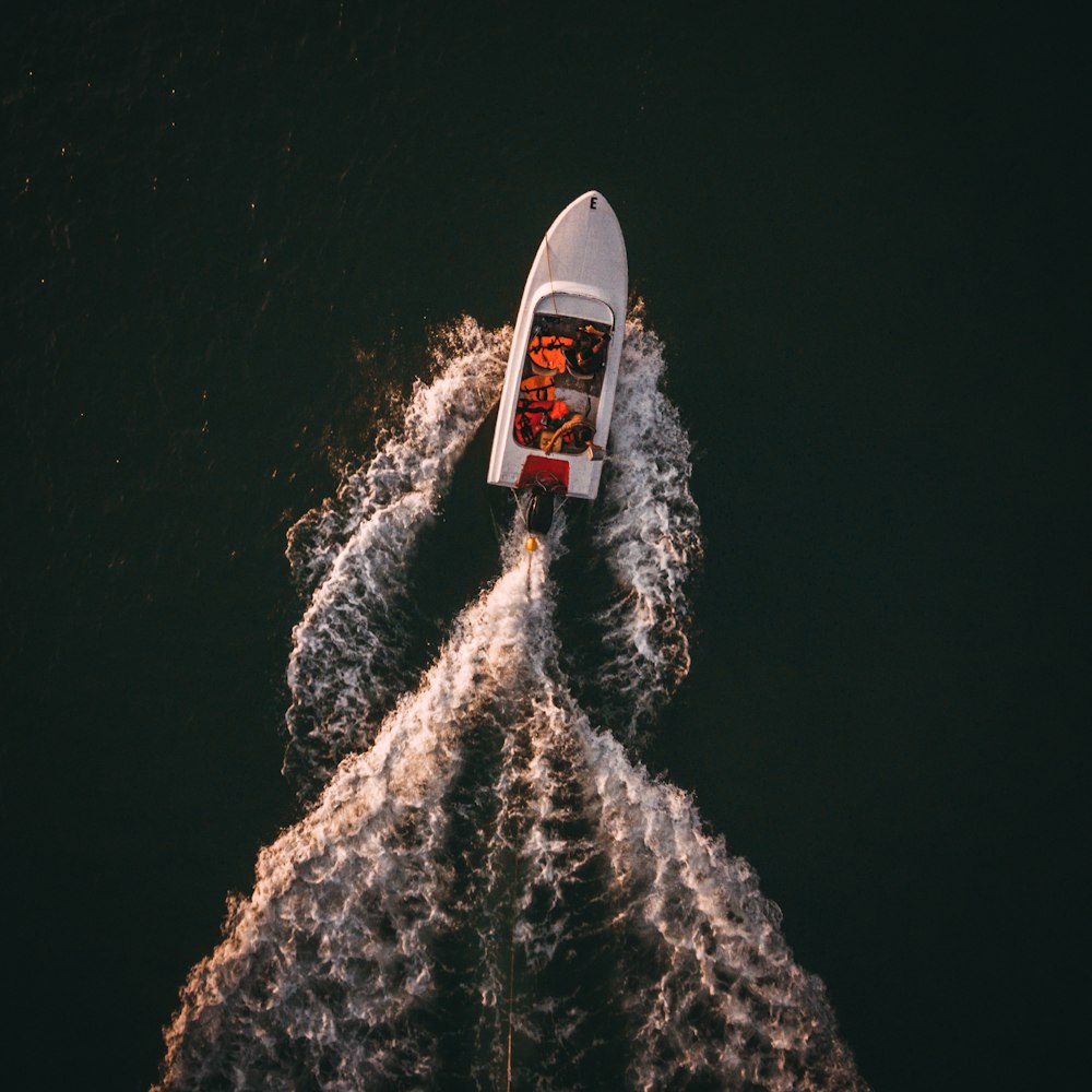 aerial view of people riding speedboat