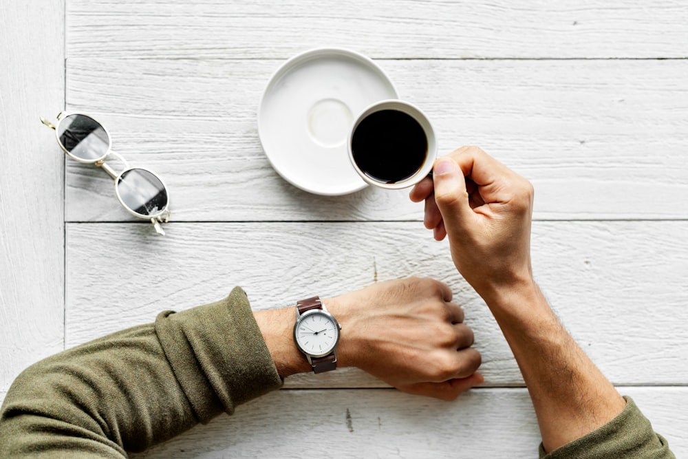 person holding a cup of coffee