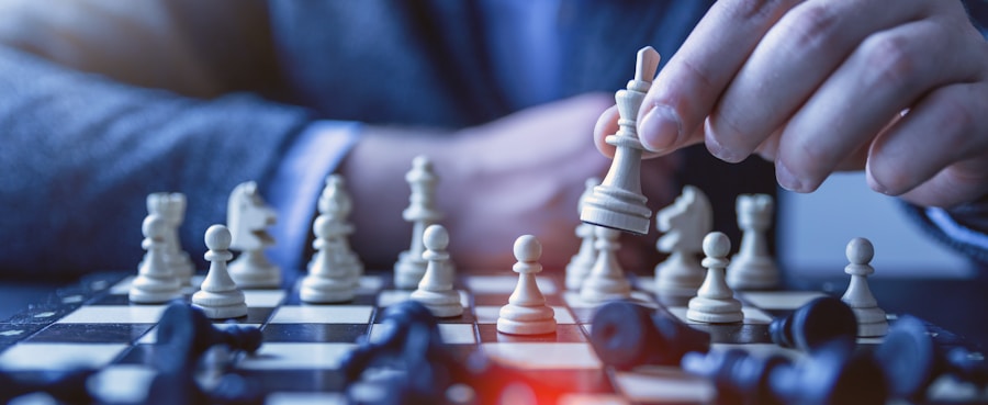 depth of field photography of man playing chess