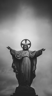 grayscale photograph of Jesus Christ statue