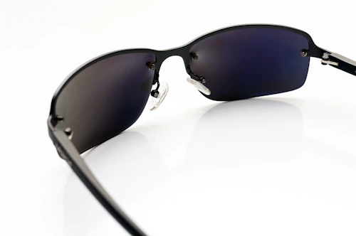 Black wayfarer sunglasses on white background