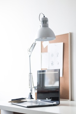 A minimalist workspace featuring sleek desktop accessories and soft lighting.