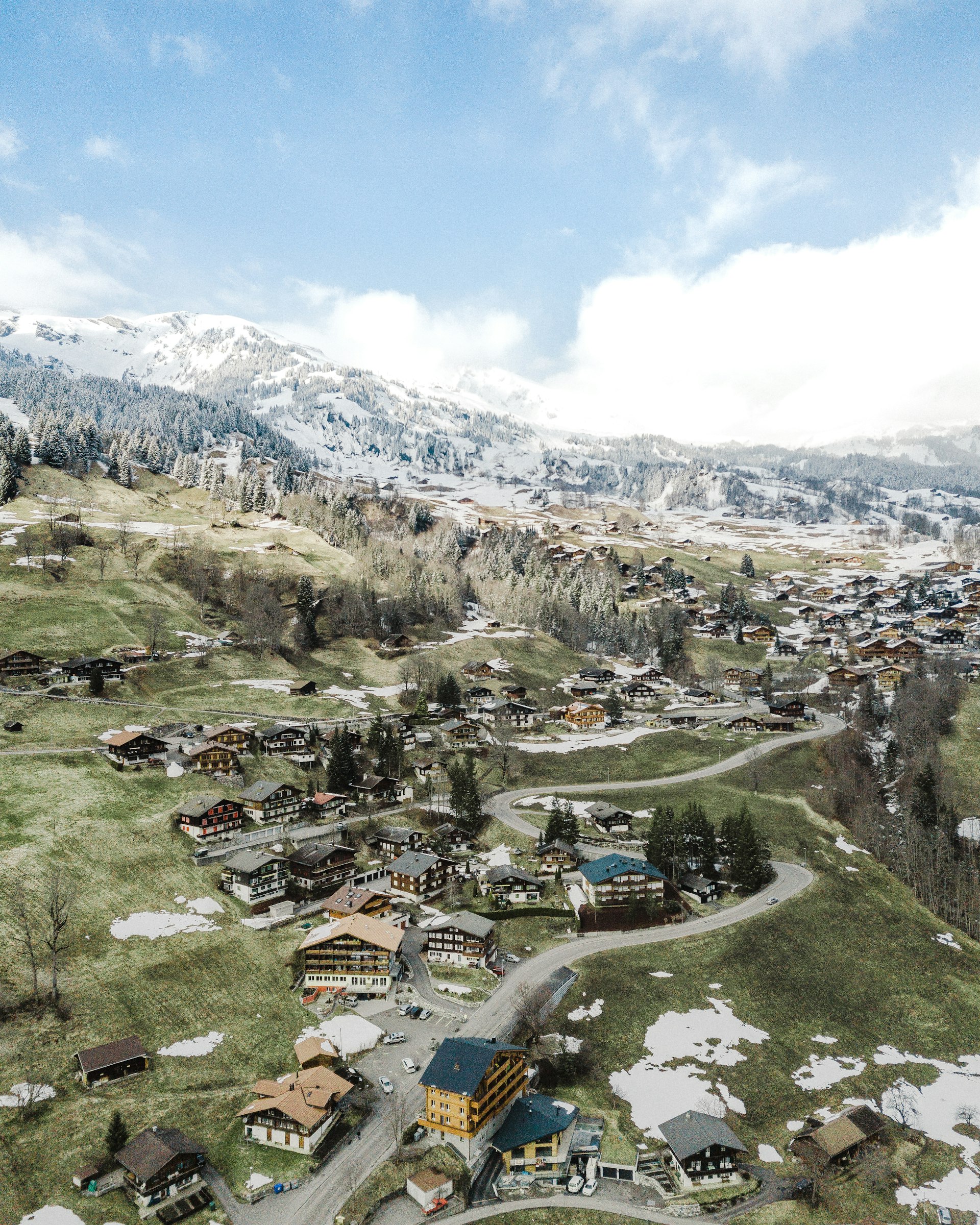 Aerial view of Grindelwald village nestled in the Swiss Alps with the Eiger mountain in the background