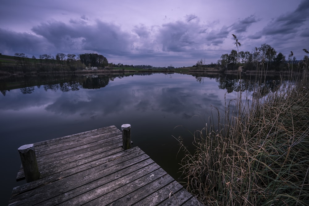 a wooden dock sitting next to a body of water