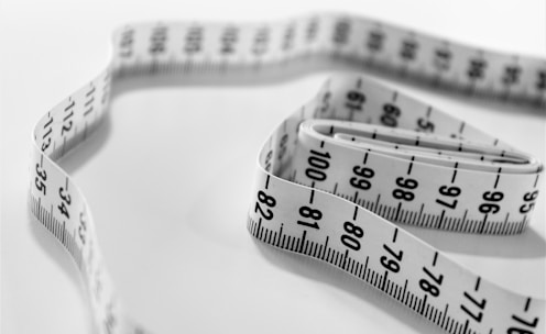 selective focus photography of tape measure