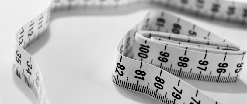 selective focus photography of tape measure
