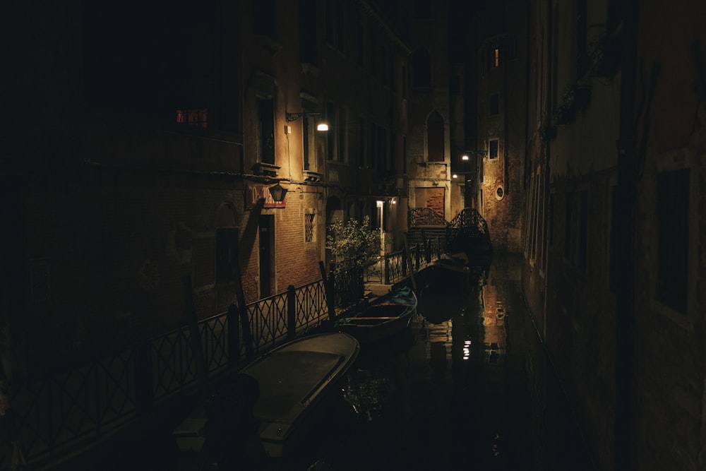 boat on canal beside house door