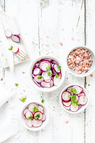 white ceramic bowls with foods