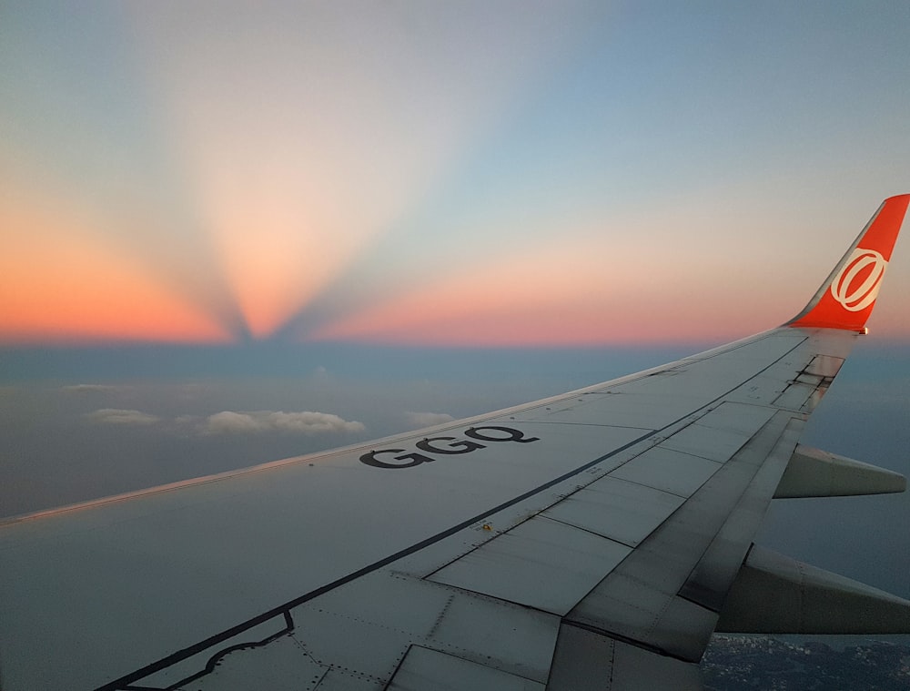 aircraft wing over sun rays