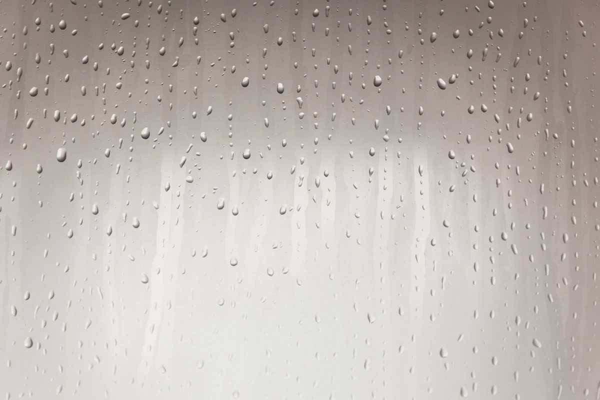 A close-up of water droplets on a window pane