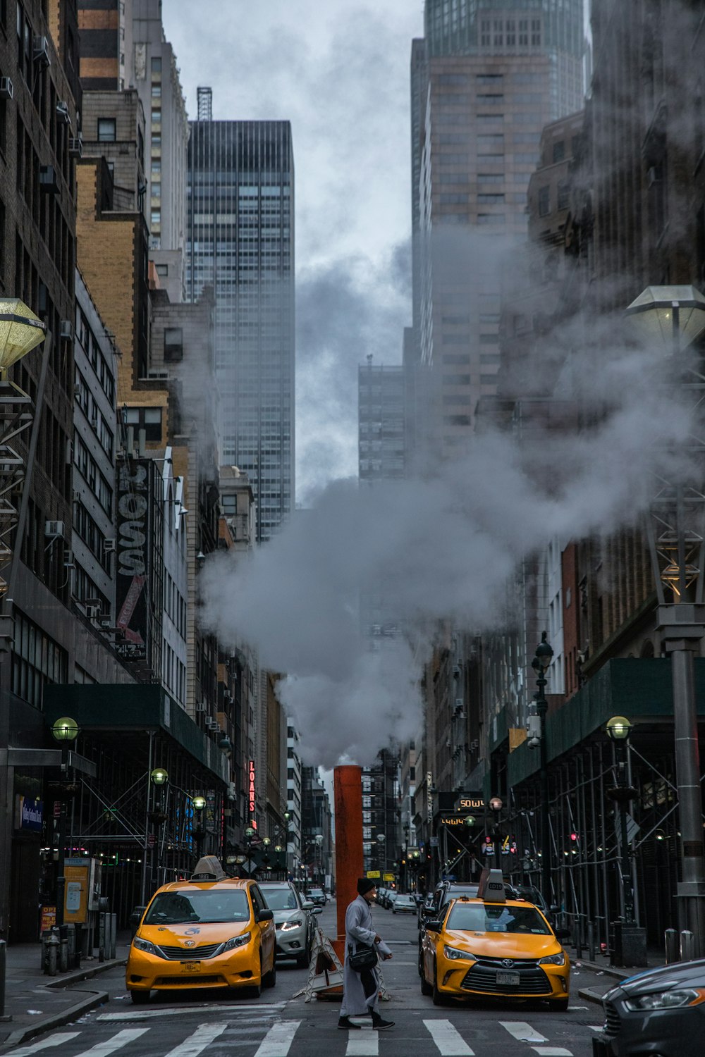 smoke between vehicles on street
