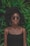 woman standing in front of green plant