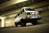 white van near concrete wall