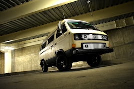 white van near concrete wall