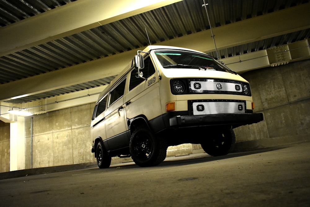 white van near concrete wall