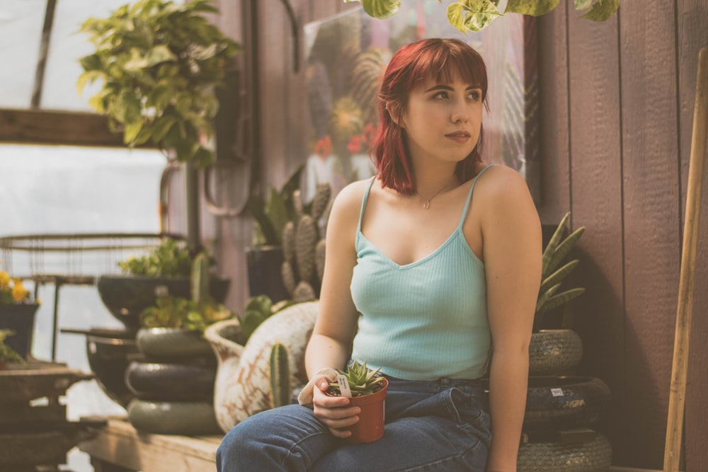 woman sitting holding pot