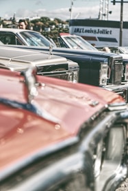 A collection of signed posters featuring iconic cars and builders.