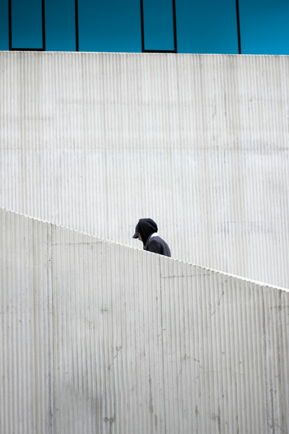 person in black cap and hoodie