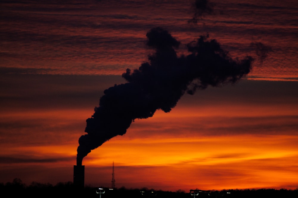 silhouette of factory smoke