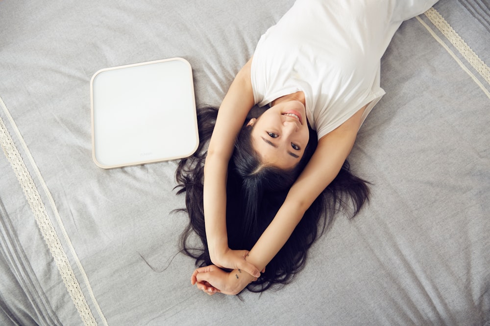 woman laying on bed