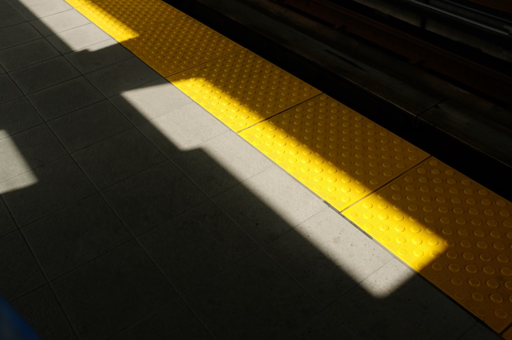 yellow mat on pathway