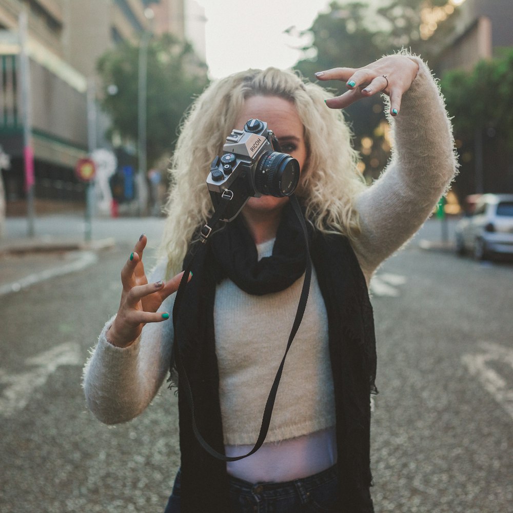 woman releasing the camera