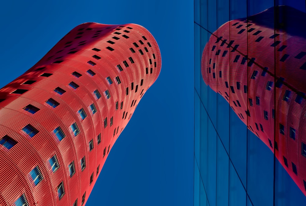 low angle photography of red concrete building