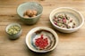 four assorted ingredients on bowls