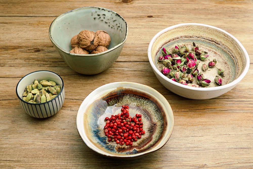 four assorted ingredients on bowls