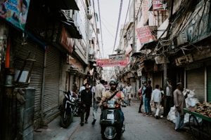 people in alley between buildings