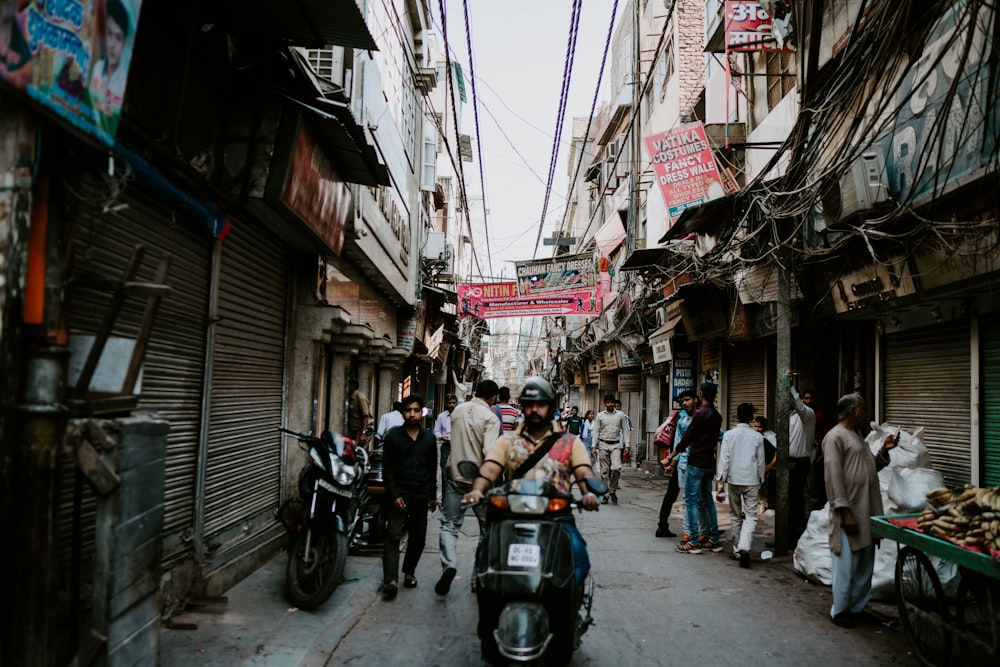 people in alley between buildings