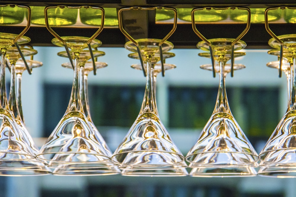 photography of cocktail glass on rack