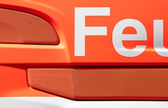 a close up of the word feu on the side of a car