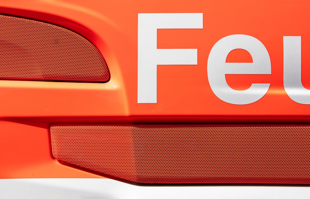 a close up of the word feu on the side of a car