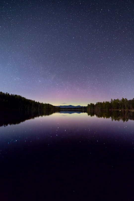 reflection photography of star and sky under calm body of water in New England United States