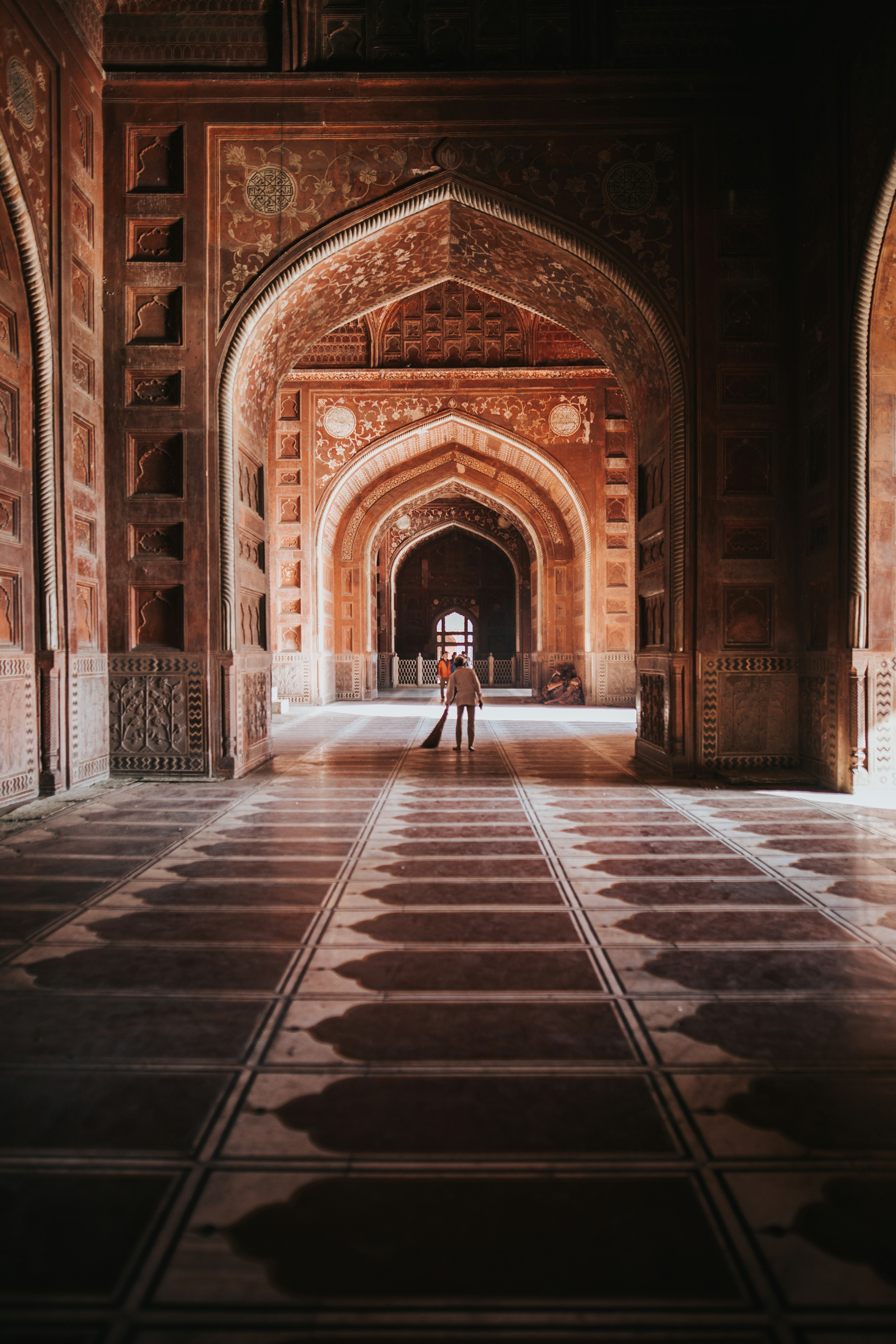 person inside the building while cleaning the floor