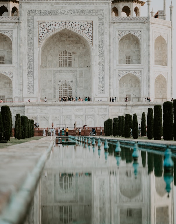 people standing in front of Taj Mahal
